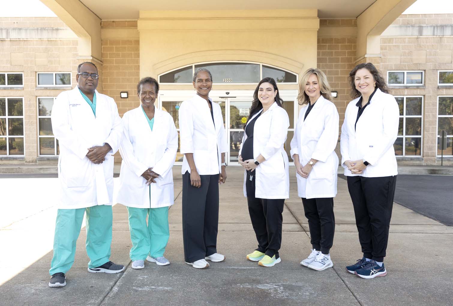 The NWMRMC Woman's Clinic team outside the clinic entrance